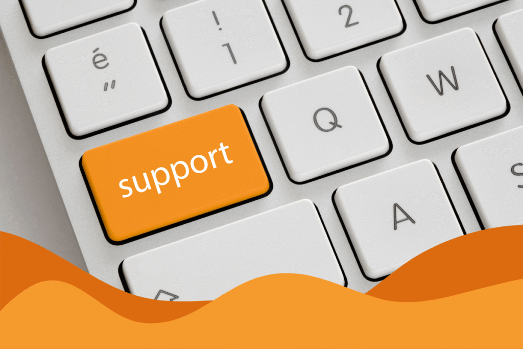 Laptop keyboard with highlighted orange button labelled 'Support' in a blog post about signs your business needs managed IT support by Daffodil IT in Sheffield.