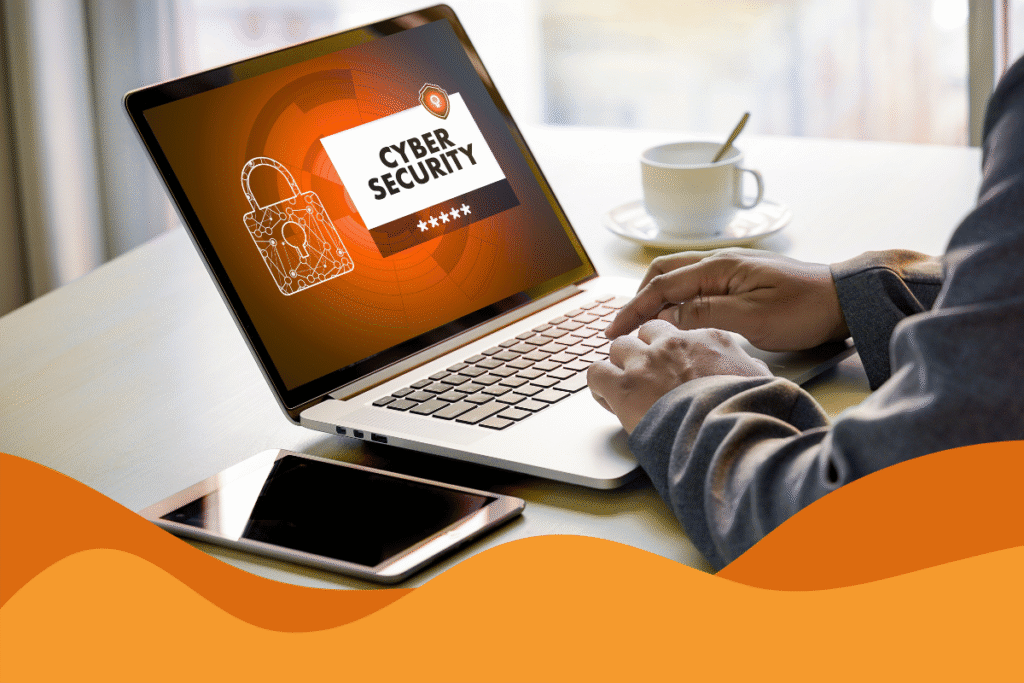 image of a man on his laptop with cybersecurity written on the screen with a lock in an article about cyber hygiene best practices