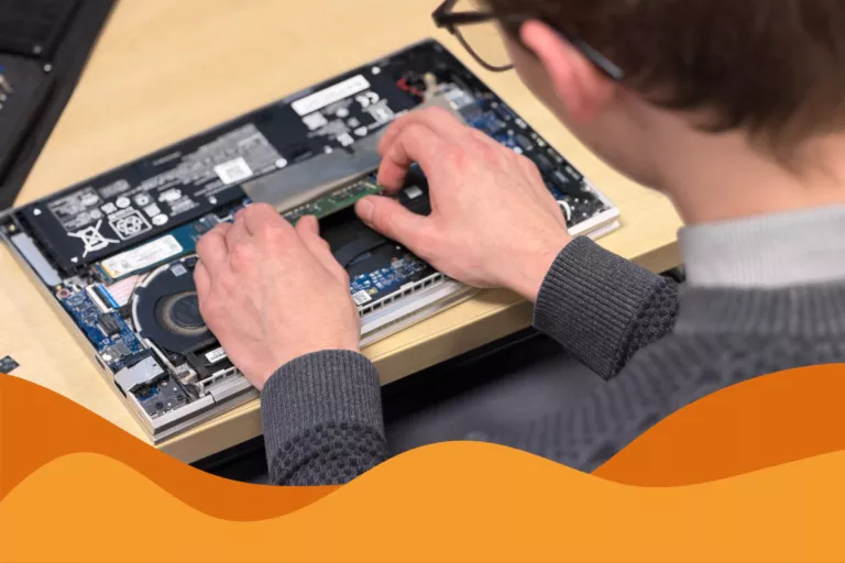image of our IT technician taking apart a laptop in an article about it support sheffield zero trust security
