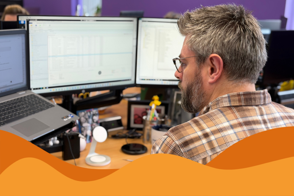 Image of IT support technician at his desk looking at various screens in an article about what IT infrastructure is for businesses in South Yorkshire by Daffodil IT in Sheffield.