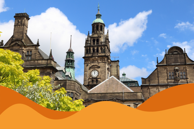 Image of Sheffield Town Hall against a bright blue sky in an article discussing Julys cybersecurity risks to businesses in South Yorkshire and Sheffield, by Daffodil IT in Sheffield.