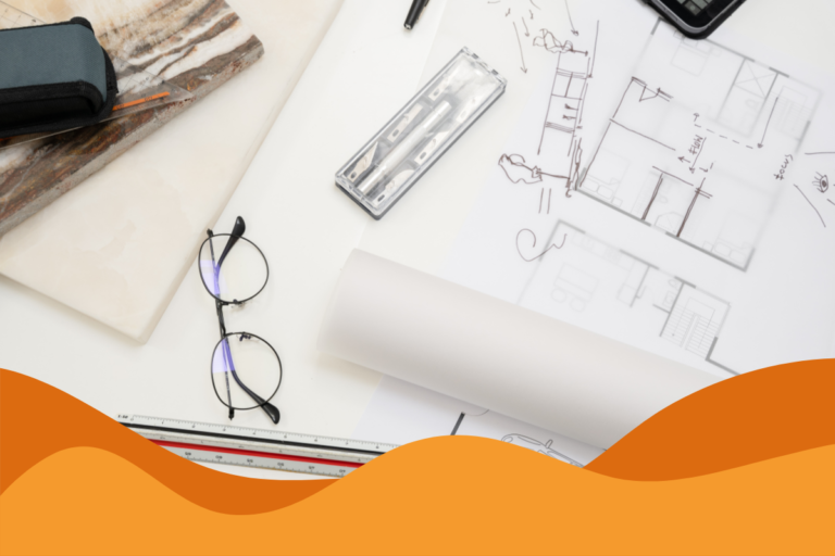 image of a table laid out with architecture papers, building designs and equipment in an article about it support for architecture firms by Daffodil IT in Sheffield, South Yorkshire.