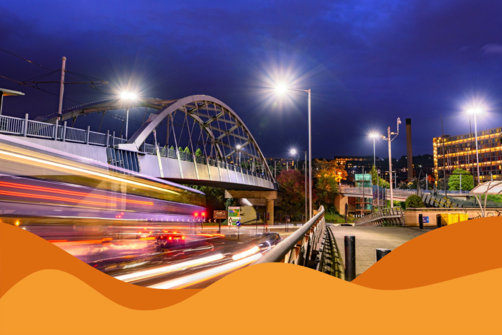 Image of Sheffield traffic underneath a bridge in Park Square at night in an article about what businesses should expect from IT support in Sheffield by Daffodil IT in Sheffield, South Yorkshire.